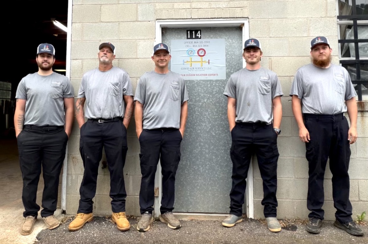 The Good Air Service LLC team standing in front of the shop